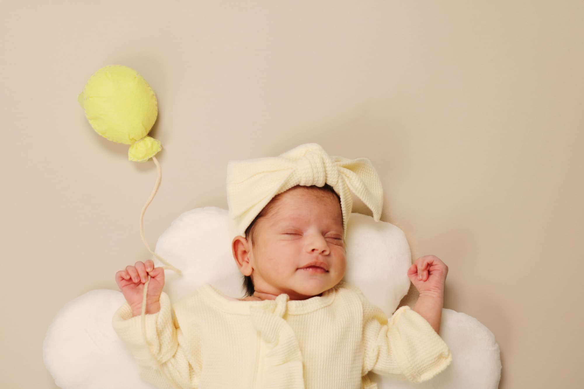 Beautiful stylish blonde woman in trench coat looking away dreamily