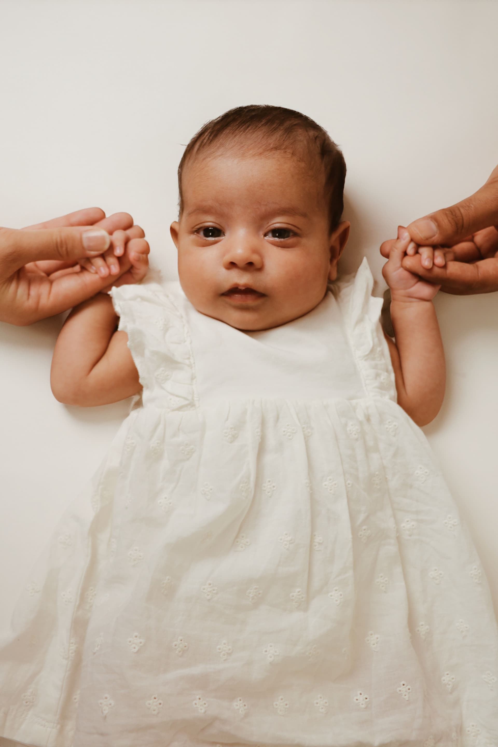 Beautiful stylish blonde woman in trench coat looking away dreamily